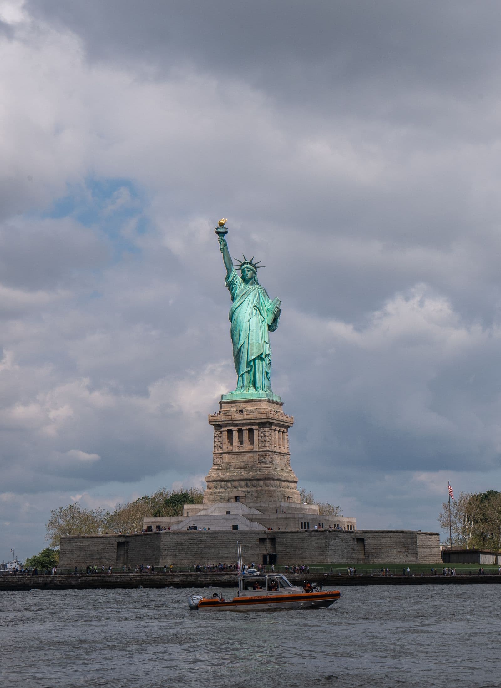 Statue of Liberty with a passing boat