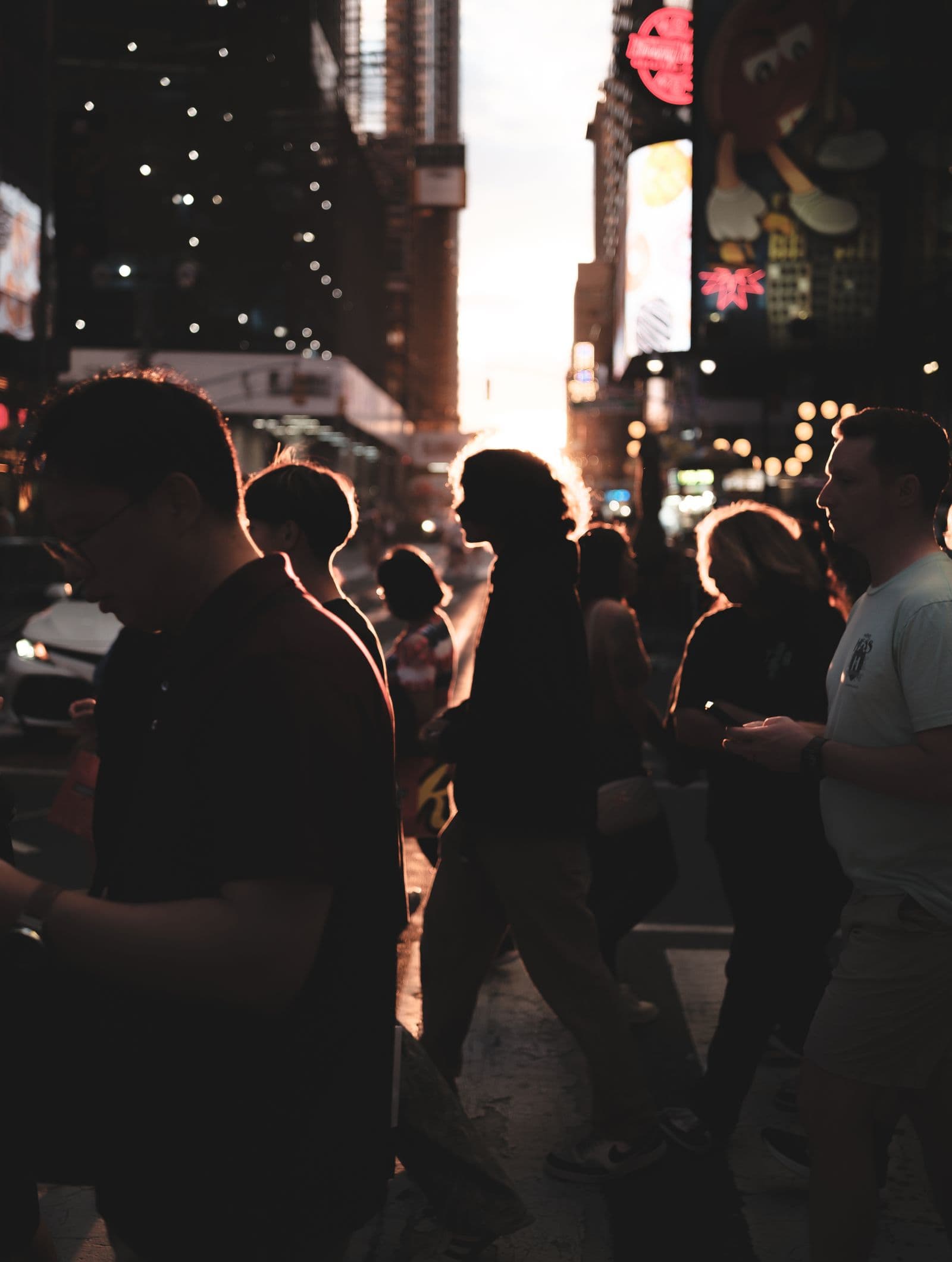 Pedestrians in silhouette at Times Square