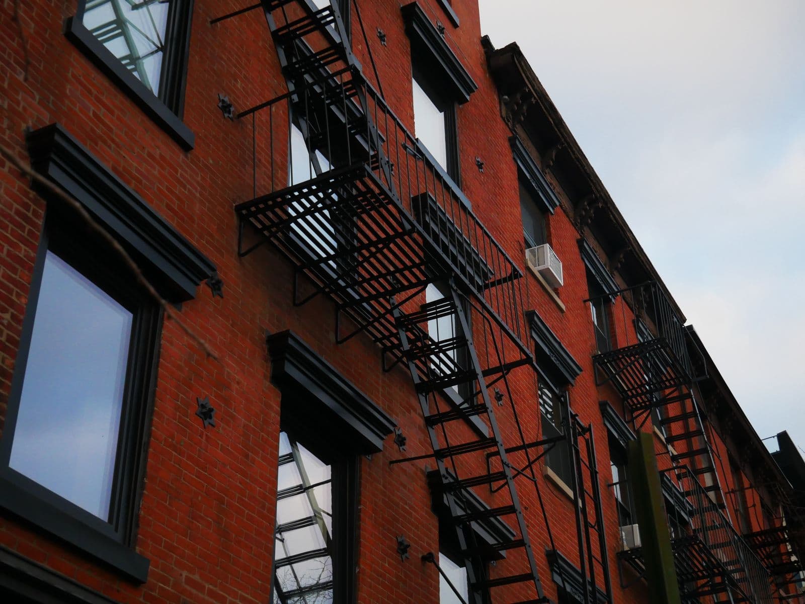 Brick building with fire escapes